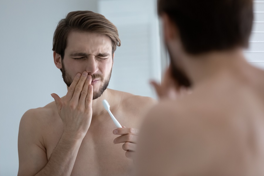 WHAT DOES IT MEAN IF MY GUMS HURT AND BLEED WHEN I BRUSH MY TEETH?